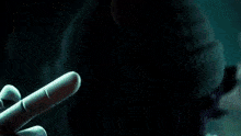a blurred image of a person holding a sword in their hand