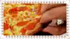 a person is holding a slice of pizza in their hand .