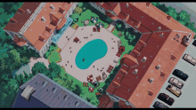 an aerial view of a swimming pool in a residential area