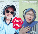 a man and a woman wearing headphones with a heart that says " i love you " on it