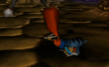 a video game character is laying on the ground .
