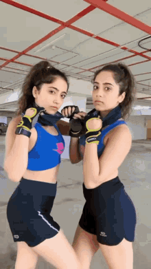 female boxing fighting two girls training