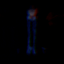 a blurred image of a person 's face in the dark
