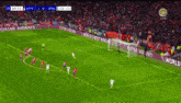 a soccer game is being played on a tv screen