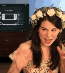 a woman with a flower crown on her head playing a video game