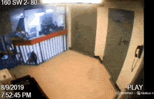 a video of a person walking down a hallway with the date 8/9/2019
