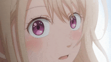 a close up of a girl 's face with a pink eye
