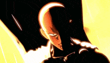 a man with a shaved head is standing in a dark room