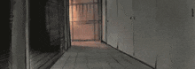 a drawing of a person in a dark room with a light shining through the window
