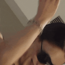a close up of a person 's arm with a bracelet on it .