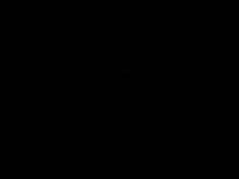 a copper fish shaped ornament is sitting on a white cloth .