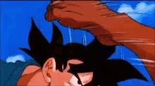 a cartoon character is being punched in the face with a blue sky in the background
