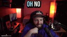 a man sitting in front of a microphone with the words oh no behind him
