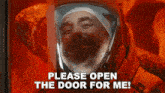 a man with a beard is wearing a helmet and saying please open the door for me