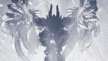 a silhouette of a statue with wings and feathers on it