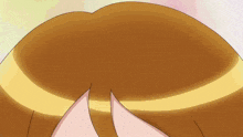 a close up of a cartoon girl 's face with a pink tongue sticking out