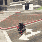 a person riding a red motorcycle on a street with an arrow pointing to the right