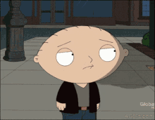a cartoon character named stewie from family guy is standing on a sidewalk