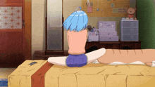 a girl with blue hair sits on a bed with a cat