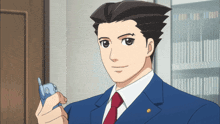 a man in a suit and tie is holding a cell phone in his hand