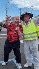 two men are posing for a picture and one has a shirt that says chees