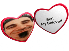 a heart shaped mirror with seri my beloved on it