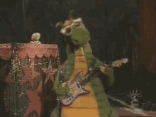 Dudley The Dragon Guitar GIF - Dudley The Dragon Guitar Rocking Out GIFs