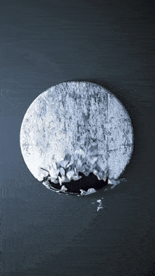 a circle with a hole in it that looks like a hole in the moon