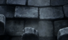 a person is standing in front of a brick wall