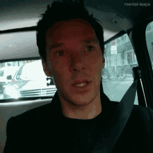 a man in a car with the words mental-leaps on the bottom right