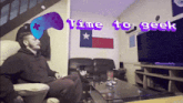 a man sits in a living room with the words time to geek on the bottom