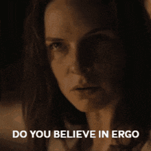 a close up of a woman 's face with the words do you believe in ergo below it