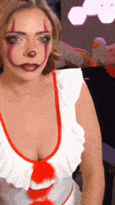 a woman is dressed as a clown with a plunging neckline