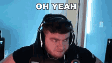 a man wearing headphones says oh yeah in a video