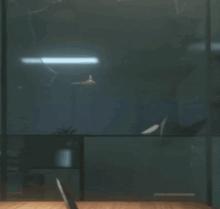 a person sitting at a desk in a dark room