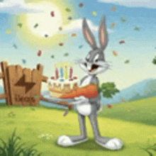 bugs bunny is holding a cake and a carrot in a field .