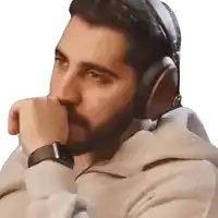 a man wearing headphones and a watch has his hand on his face