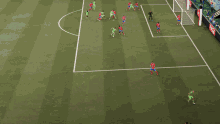a soccer game is being played on a field with a wanda advertisement