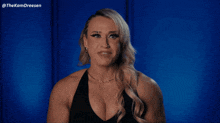 a woman says " that 's jordynne grace " in front of a blue background
