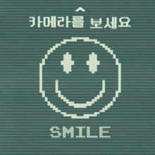 a pixelated smiley face with the words smile written below it
