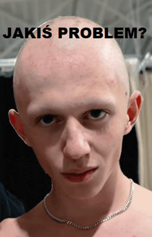 a man with a shaved head has the words jakis problem written above him