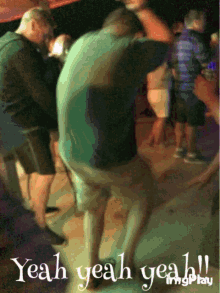 a group of people dancing with the words yeah yeah yeah written below them