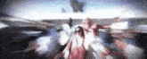 a blurry picture of a woman in a red dress standing in a crowd .