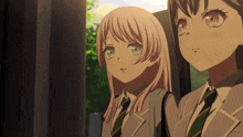 two anime girls are standing next to each other looking at something