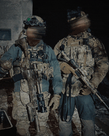 two soldiers standing next to each other with one wearing a helmet that says ' sd ' on it