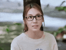 a woman wearing glasses and a t-shirt that says good times
