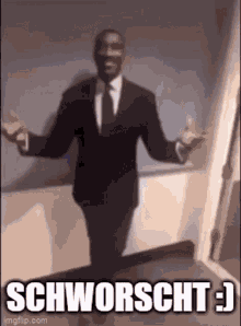 a man in a suit and tie is standing in a room with his arms outstretched and a caption that says schworscht