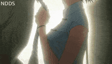 a woman in a cheongsam is holding a rope in her hand .
