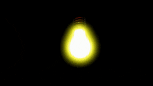 a light bulb is glowing in the dark
