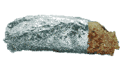 a burrito wrapped in aluminum foil on a white surface